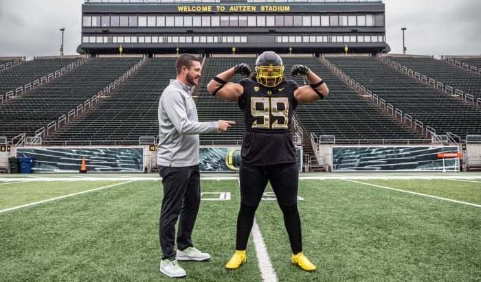Jericho Johnson and Dan Lanning inside Autzen Stadium.